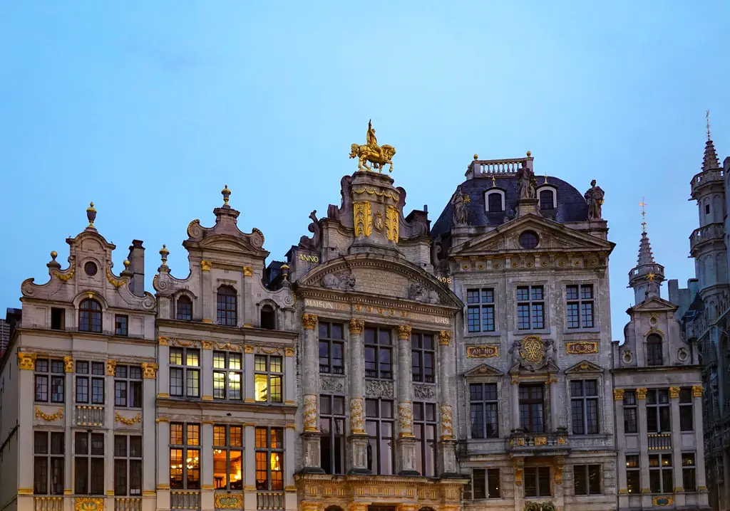 Stunning view of ornate facades at Grand Place, Brussels during twilight. A UNESCO World Heritage Site.