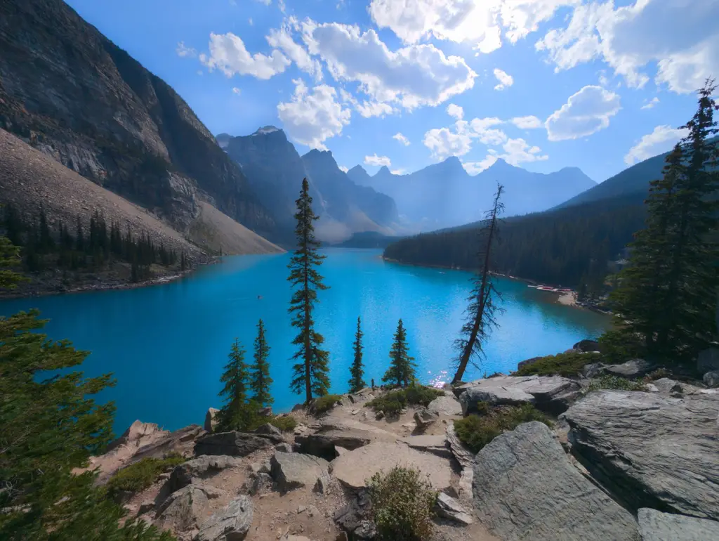 Breathtaking view of Moraine Lake with turquoise waters surrounded by mountains in Banff National Park, Canada.