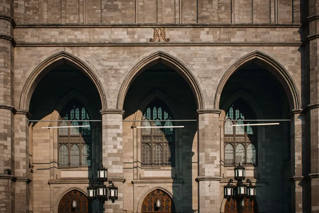 Facade of the Gothic Revival Notre-Dame Basilica in Montreal, showcasing elegant arches and intricate design.