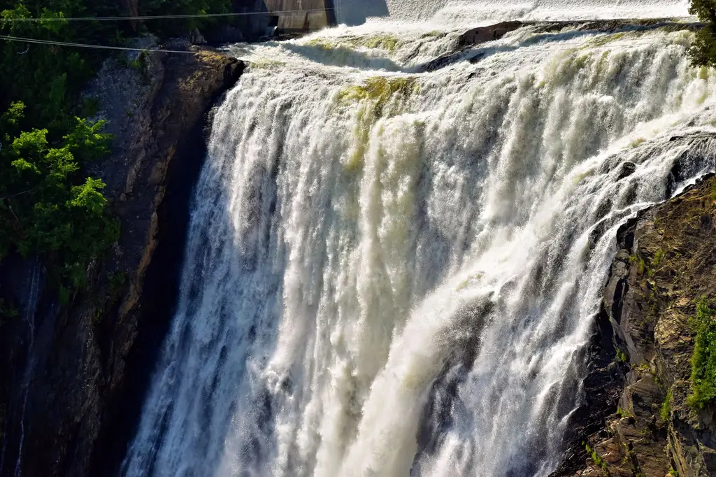 Captivating image of the powerful Montmorency Falls cascading in Quebec City, highlighting nature's majesty.