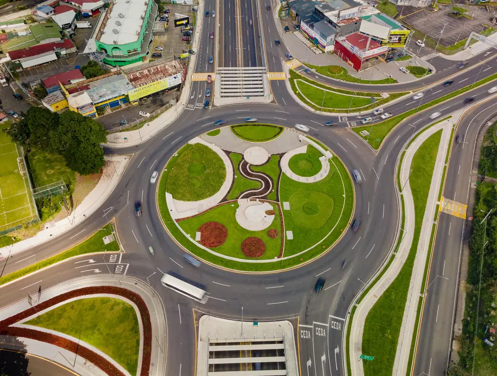 Vibrant aerial photograph of a bustling roundabout in San José, Costa Rica.