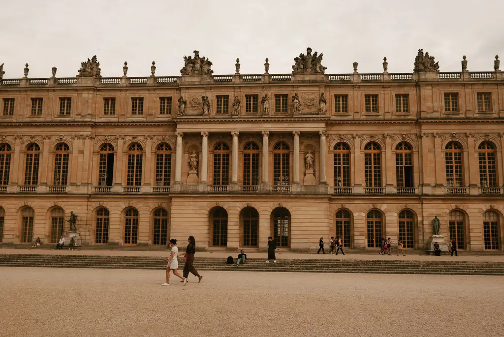 Historic Palace of Versailles facade capturing its symmetrical architecture in Paris, France.