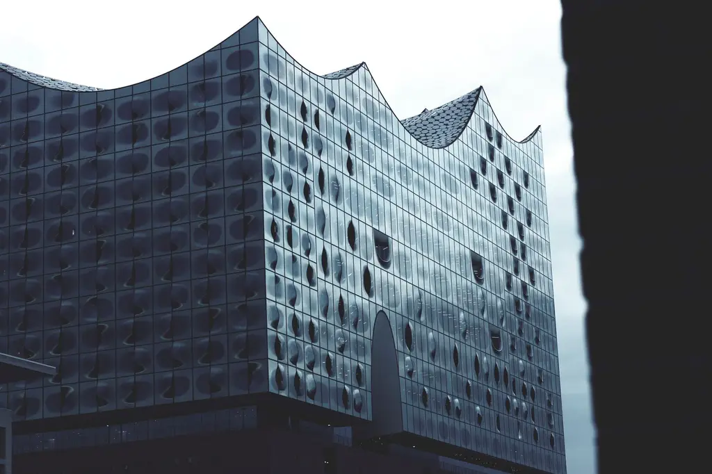 Striking modern architecture of Elbphilharmonie in Hamburg, Germany, captured with a monochrome tone.