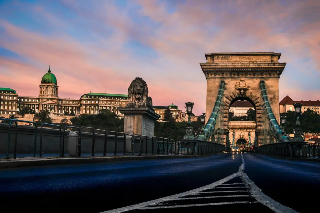 Captivating view of the Széchenyi Chain Bridge with Buda Castle in Budapest at sunset.