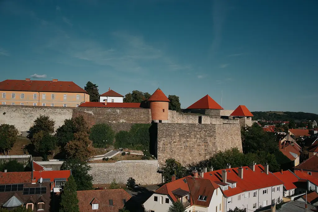 Explore Eger Castle's historic architecture and charming cityscape under a clear blue sky.