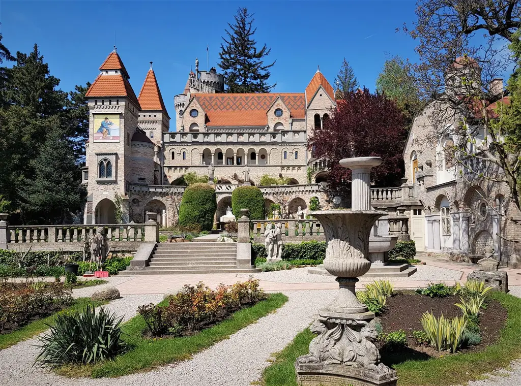 Explore the enchanting Bory Castle in Hungary, surrounded by lush gardens and rich history.