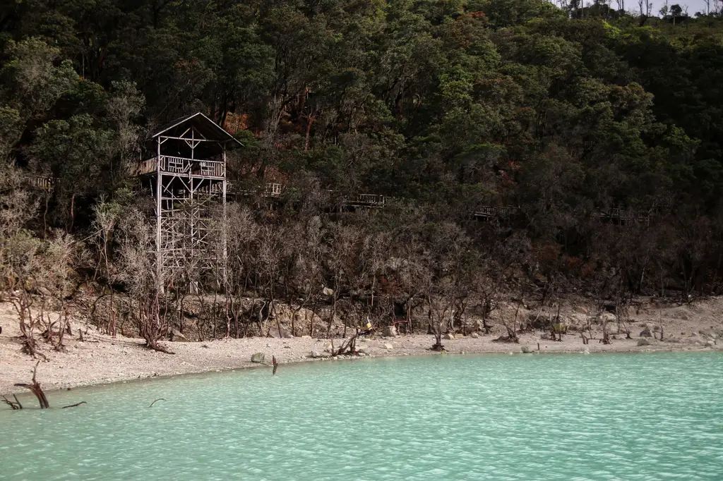 Explore the mesmerizing turquoise crater of Kawah Putih in Ciwidey, Indonesia.