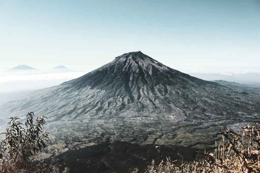 Breathtaking landscape with Mount Merapi volcano in the early morning light.