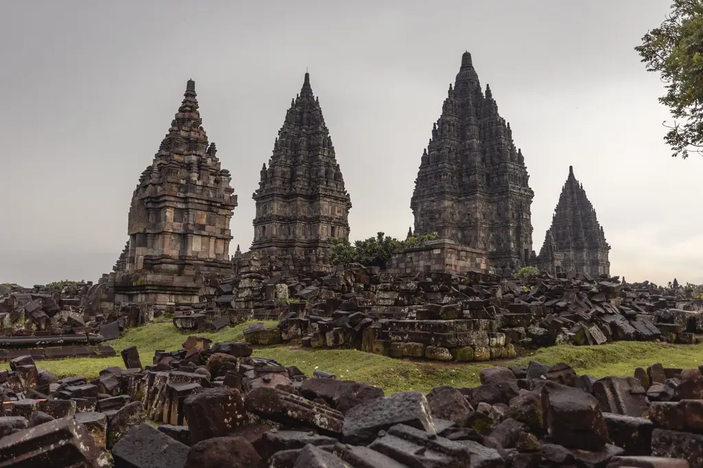 Low angle of ancient Prambanan Hindu temple against sunset sky located on territory of archaeological park in Indonesia