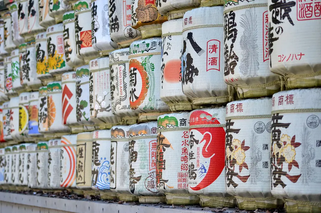 Close-up view of decorative sake barrels in Kyoto, showcasing Japanese culture and tradition.