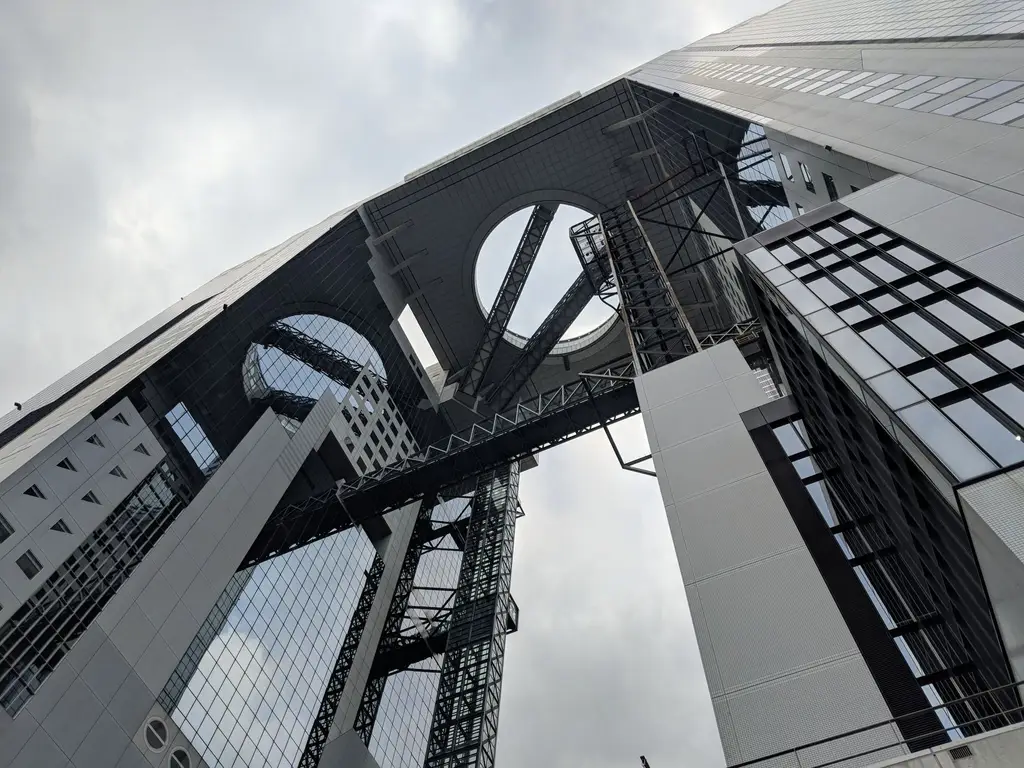 Low angle view of the innovative Umeda Sky Building, showcasing modern architecture in Osaka, Japan.