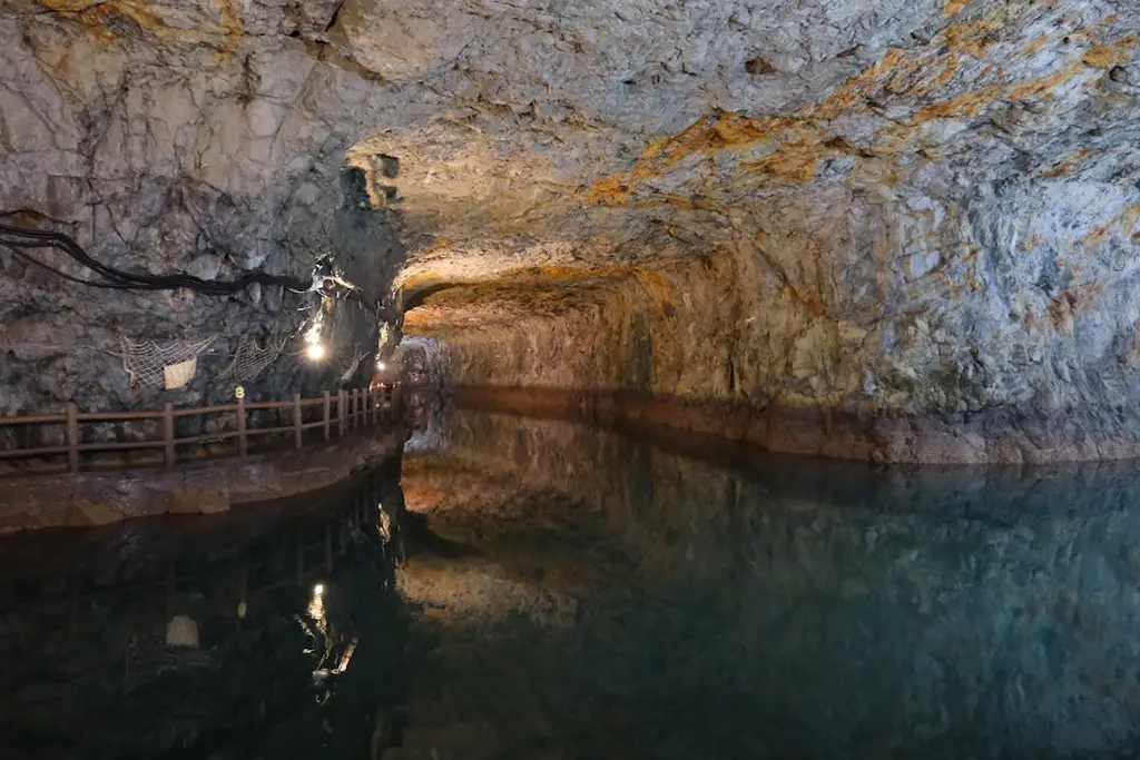 Underground tunnel with water and lights reflected