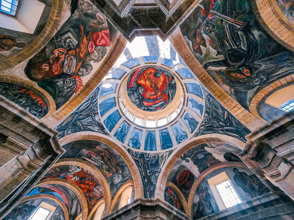 Explore the mesmerizing murals on the dome of Hospicio Cabañas in Guadalajara, Mexico.