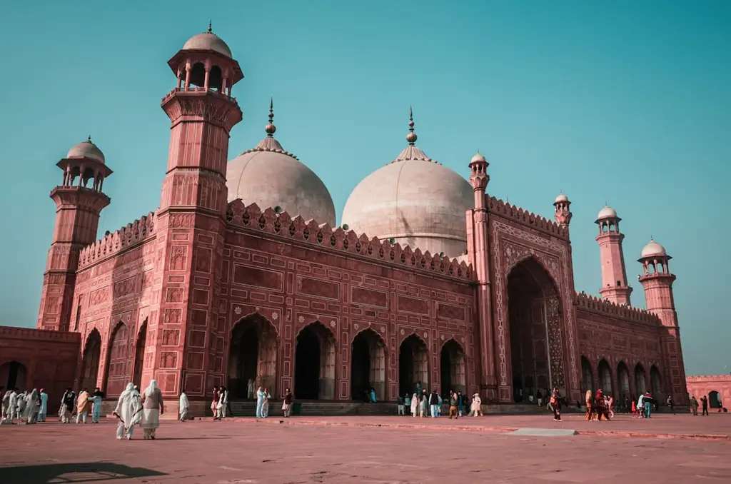 The Badshahi Mosque with red sandstone walls and white domes in Lahore, Pakistan