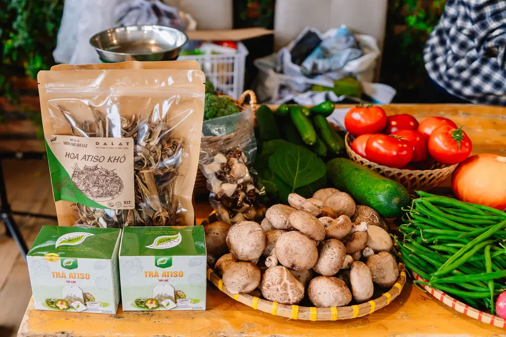 Vibrant fresh market scene featuring vegetables, mushrooms, and artichoke tea packs.