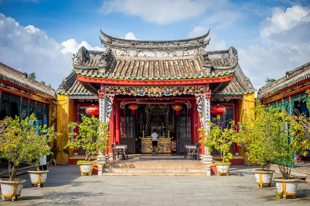 Beautifully ornate pagoda in Hoi An, Vietnam, showcasing traditional architecture and vibrant colors.